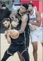  ?? Robert Gauthier L.A. Times ?? LAKERS Tyler Ennis, left, and Thomas Bryant go after the basketball.