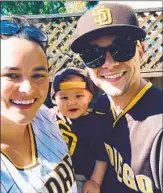  ?? COURTESY OF RILEY FAMILY ?? Lifelong Padres fan Keenan Riley with his wife, Peris, and son, Kai.