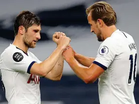  ??  ?? Well done, skipper: Ben Davies celebrates with Kane