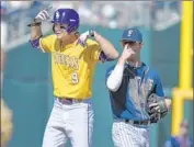  ?? Ted Kirk
Associated Press ?? MARK LAIRD of Louisiana State stands at second base after hitting an eighth-inning double.