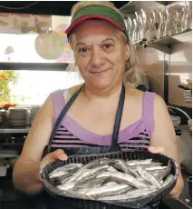  ?? PHOTOS: JOANNE BLAIN/VANCOUVER SUN ?? Try eating like the locals, and grab some fresh sardines at the Bolhao public market in Porto.