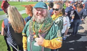  ?? MIKE DE SISTI / MILWAUKEE JOURNAL SENTINEL ?? Russell Beckman, shown at the Bears-Packers game on Sept. 13, 2015, at Soldier Field, is suing the Bears. He signed up for an on-field experience in 2016, but he says the Bears wouldn’t let him on the field because he was in Packers gear. See video at...