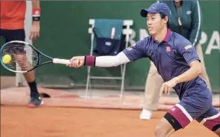  ?? Tim Clayton / Corbis via Getty Images ?? Kei Nishikori tested negative for COVID-19 after twice testing positive, but he will be quarantini­ng after being on a flight from Los Angeles that had positive tests.