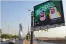  ?? Photograph: Fayez Nureldine/ AFP/Getty Images ?? An electronic billboard bearing the portraits of King Salman bin Abdulaziz Al Saud (right) and his son Mohammed bin Salman in Riyadh.