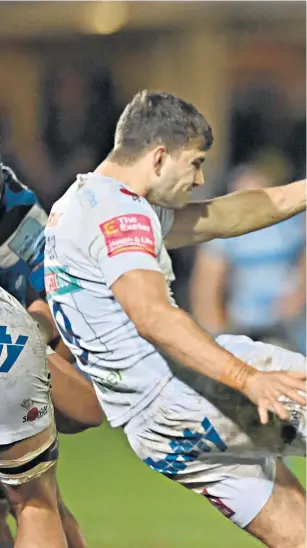  ?? ?? Battling: Bath’s Ben Spencer tries to charge down a kick from Jack Maunder of Exeter