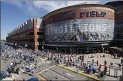  ?? ASSOCIATED PRESS FILE PHOTO ?? Fans arrive at Ford Field for a Detroit Lions game.