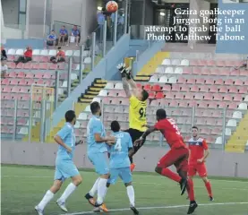  ??  ?? Gzira goalkeeper Jurgen Borg in an attempt to grab the ball Photo: Matthew Tabone