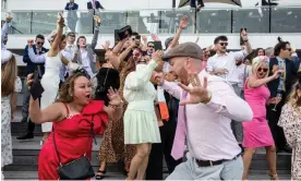  ?? Photograph: Diego Fedele/Getty Images ?? Revellers at the 2021 Melbourne Cup. Attendance numbers for the annual event have been dwindling.