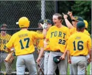  ?? CHRISTINE WOLKIN — FOR DIGITAL FIRST MEDIA ?? Members of the Fort Washington team celebrate a run during their Lower Montco American Legion playoff game against Roslyn at Upper Dublin High School on Thursday, July 6, 2017.