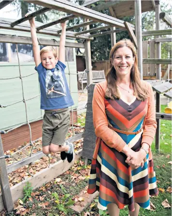  ??  ?? Screening: Dr Elizabeth Kilbey with her son, nine-year-old Elliot, who was given his own tablet at the age of four – but with rules