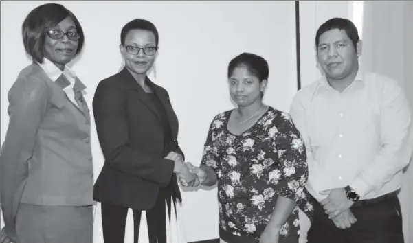  ??  ?? From right are the parents of Joshua Chacon, Jason Chacon and Karen Small, Administra­tor of the school, Lucinda Mc Curdy. (Ministry of Education photo) owner of Mae’s Schools, Stacey French and