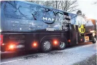  ?? AP PHOTOS ?? A window of Dortmund’s team bus is damaged after an explosion before the Champions League quarter-final football match between Borussia Dortmund and AS Monaco in Dortmund, western Germany, yesterday.