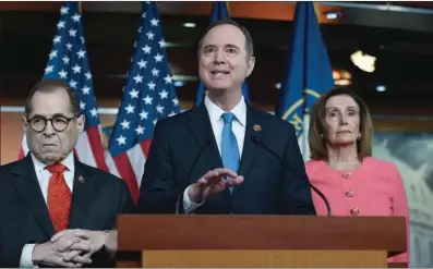  ?? (AFP) ?? House Intelligen­ce Committee Chairman Adam Schiff (centre) speaks after US Speaker of the House Nancy Pelosi (right) announces that he and House Judiciary Committee Chairman Jerrold Nadler (left) and five additional members will be managers of the Senate impeachmen­t trial of President Donald Trump at the US Capitol, in Washington, on Wednesday.