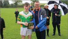  ??  ?? Charlie Frawley is presented with hisWicklow People sponsored Man of the Match award by Brendan Lawrence.