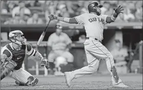  ?? Associated Press ?? Headed to the Phillies: In this Oct. 9, 2017, file photo, Cleveland's Carlos Santana connects for a two-run home run against the New York Yankees during the fourth inning in Game 4 of baseball's American League Division Series in New York. Two people familiar with the situation say the Phillies and the veteran first baseman have agreed to a three-year, $60 million deal.