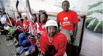  ??  ?? Members of Kenya’s only ice hockey team sit on the bench during a practice session at the Solar Ice Rink in Nairobi. It’s East Africa and Central Africa’s only ice rink, and welcomes any and everyone who wants to lace up. — Reuters