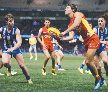  ?? Picture: GETTY IMAGES ?? Lachie Weller in action for the Suns against North Melbourne.