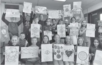  ?? [ALI WILSON / THE OBSERVER] ?? Grade 5 and 6 students from Elmira’s John Mahood PS completed their posters to be submitted for the Lions Club Peace Poster Contest. Back row:, Parker M, Kasten S, Katie E, Pacey C, Ella J, Lily H. Middle row: Troy D, Ethan B, Hayden G, Dylan B, Nora...