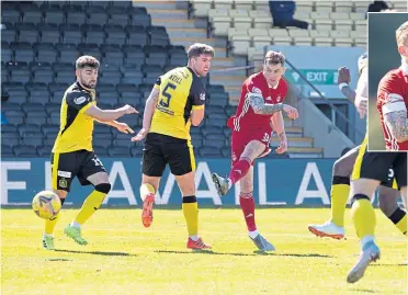  ??  ?? Callum Hendry fires home to settle Aberdeen’s nerves and put them into the next round
