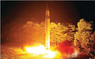  ?? KCNA VIA KNS/AFP ?? An interconti­nental ballistic missile, the Hwasong-14, is lauched at an undisclose­d place in North Korea.