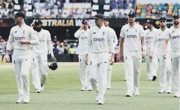  ?? ?? England Captain Joe Root (centre) walks off with his team after defeat during day four of the first Ashes test at The Gabba, Brisbane.