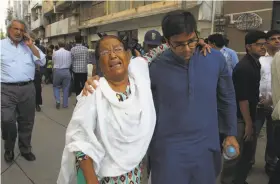  ?? Photos by Shakil Adil / Associated Press ?? A woman mourns after attending the funeral prayers of women’s rights activist Sabeen Mahmud, who was killed by unknown gunmen in Karachi.