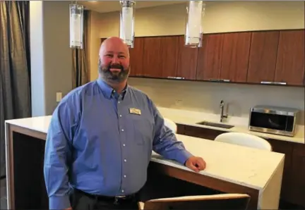  ?? GARY PULEO — DIGITAL FIRST MEDIA ?? Valley Forge Casino Resort CEO Eric Pearson in the kitchen area of one of the newly remodeled suites in the casino tower.