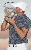  ?? GETTY IMAGES FILE PHOTO ?? Ben Silverman of Canada poses with the trophy after winning in a playoff during the final round of The Bahamas Great Abaco Classic last week in Great Abaco, Bahamas.