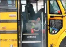  ?? LORETTA RODGERS — DIGITAL FIRST MEDIA ?? A Widener University nursing student, portraying an accident victim, waits for help on a school bus that was involved in a “collision” with a car.