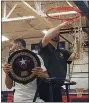  ?? MEDIANEWS GROUP PHOTO ?? Archbishop Wood’s Rahsool Diggins, left, holds the Philadelph­ia Catholic League championsh­ip plaque while head coach John Mosco cuts down the net at Cardinal O’Hara High School.