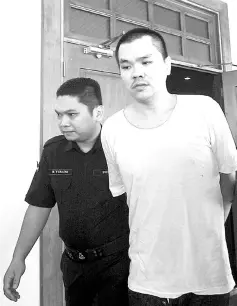  ??  ?? Keow leaving the High Court after he was sentenced to death. - Bernama photo