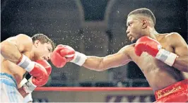  ??  ?? Pernell Whitaker, nicknamed ‘Sweet Pea’, throws a punch at Julio Cezar Vasquez in March 1995