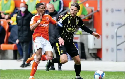  ?? Picture: Robbie Stephenson ?? Bristol Rovers’ Luke Leahy comes under pressure from Blackpool’s Dimitri Mitchell