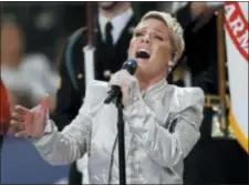  ?? AP PHOTO/MATT YORK ?? Pink performs the national anthem before the NFL Super Bowl 52 football game between the Philadelph­ia Eagles and the New England Patriots Sunday.