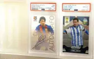  ??  ?? Soccer star Lionel Messi cards are displayed at Bleecker Trading.