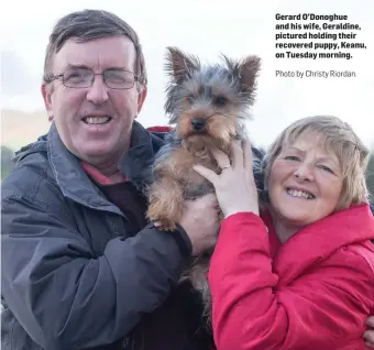  ?? Gerard O’Donoghue and his wife, Geraldine, pictured holding their recovered puppy, Keanu, on Tuesday morning.
Photo by Christy Riordan. ??