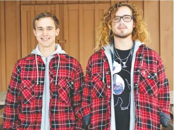  ?? [VERONICA REINER / THE OBSERVER] ?? Elmira Venturers Max Campbell (left) and Eric Zinke-Spencer, seen here at the Rover den on Oriole Parkway, were among the recipients of this years’ Queen’s Venturer Awards.