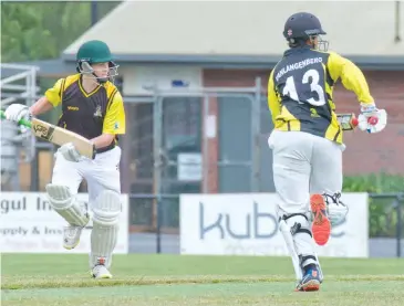  ??  ?? Jindivick batsmen James Keogh (left) and Xavier Van Langenberg cross during an exciting run chase against Western Park on Saturday morning. Keogh scored six runs and Van Langenberg got 25 not out in the under 16 game.
Right: Western Park’s Connor McCluskey slides in the field to keep the pressure on Jindivick during a great contest in the under 16 division.
Photograph­s by Michael Robinson.