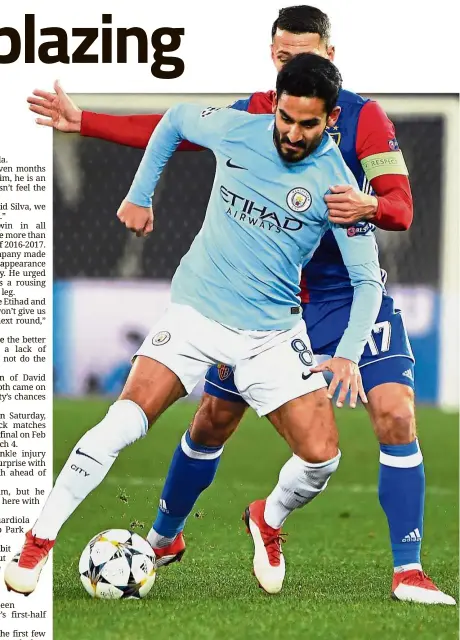  ?? —AFP ?? Keep off: Manchester City’s Ilkay Gundogan (left) shielding the ball from Basel’s Marek Suchy during the Champions League last 16 first-leg match at Saint Jakob Park on Tuesday.