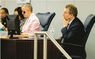  ?? VINCENT ALBAN/CHICAGO TRIBUNE ?? Pedro Martinez, right, CEO of Chicago Public Schools, listens to speakers during a Chicago Board of Education meeting on Feb. 22 in Chicago.