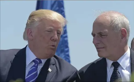  ?? AP PHOTO/SUSAN WALSH ?? President Donald Trump talks with Homeland Security Secretary John Kelly during commenceme­nt exercises at the U.S. Coast Guard Academy in New London, Conn., on May 17. Trump named Kelly as his new Chief of Staff on Friday, ousting Reince Priebus.