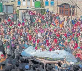 ?? AP PHOTO ?? Kashmiri villagers carry the body of soldier Ghulam Mohi ud Din Rather, who was killed in Thursday's attack, during his funeral at Panjpora village, 40 kilometres south of Srinagar on Friday. Banned militant organisati­on Hizbul Mujahideen had ambushed...