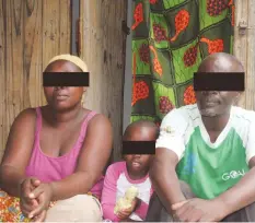  ??  ?? Mary with her husband and one of her daughters at their home at Tongogara refugee camp