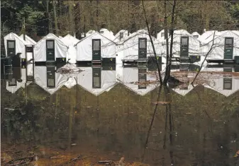  ?? Michael Macor / The Chronicle ?? Flood waters reached the bottom of the tent cabins at Half Dome Village at Yosemite National Park. The park is scheduled to be completely open by Wednesday.