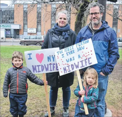  ?? KATIE SMITH/THE GUARDIAN ?? Kate Fraser and Doug Morum attend a midwifery rally in Charlottet­own Saturday with their children, James Morum, 5, and Rowan Morum, 3.