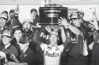  ?? STEPHEN M. DOWELL ORLANDO SENTINEL ?? Denny Hamlin celebrates in Victory Lane after winning the Daytona 500 NASCAR race Sunday.