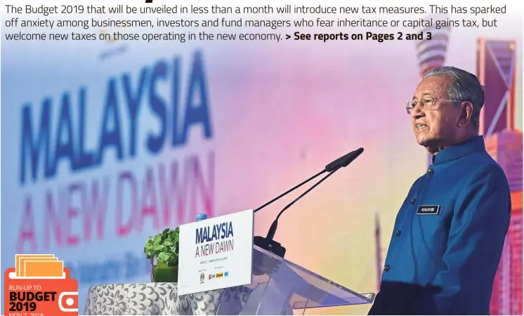  ?? — RAJA FAISAL HISHAN/ The Star ?? Man of the hour: Prime Minister Tun Dr Mahathir Mohamad delivering his keynote address at the ‘Malaysia: A New Dawn’ conference.