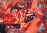  ??  ?? In addition to roasted green chile, Los Chile Brothers offers red chile from the 2017 crop.