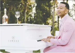  ?? LVE ?? John Legend isn’t afraid of a little pink. The musician has partnered up with a Napa Valley winemaker to release a rosé.