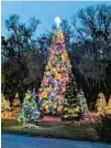  ?? PATRICK CONNOLLY/ ORLANDO SENTINEL ?? Wekiva Island is decorated as a “Winter Wonderland” in Longwood on Dec. 2.